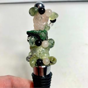 Wine bottle stopper with natural gemstone top.